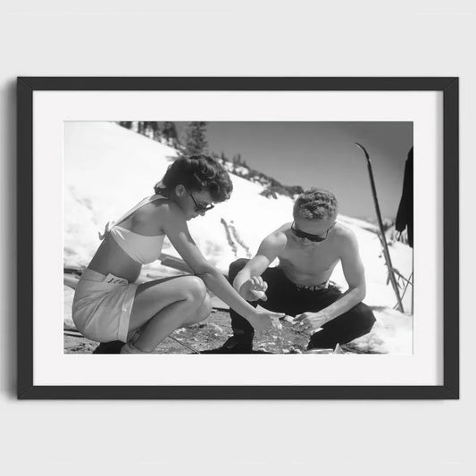 Couple Applying Sunscreen | Retro Ski Vacation Poster | Sunny Ski Days and Unexpected Warmth | Vintage Winter Sports Art Print
