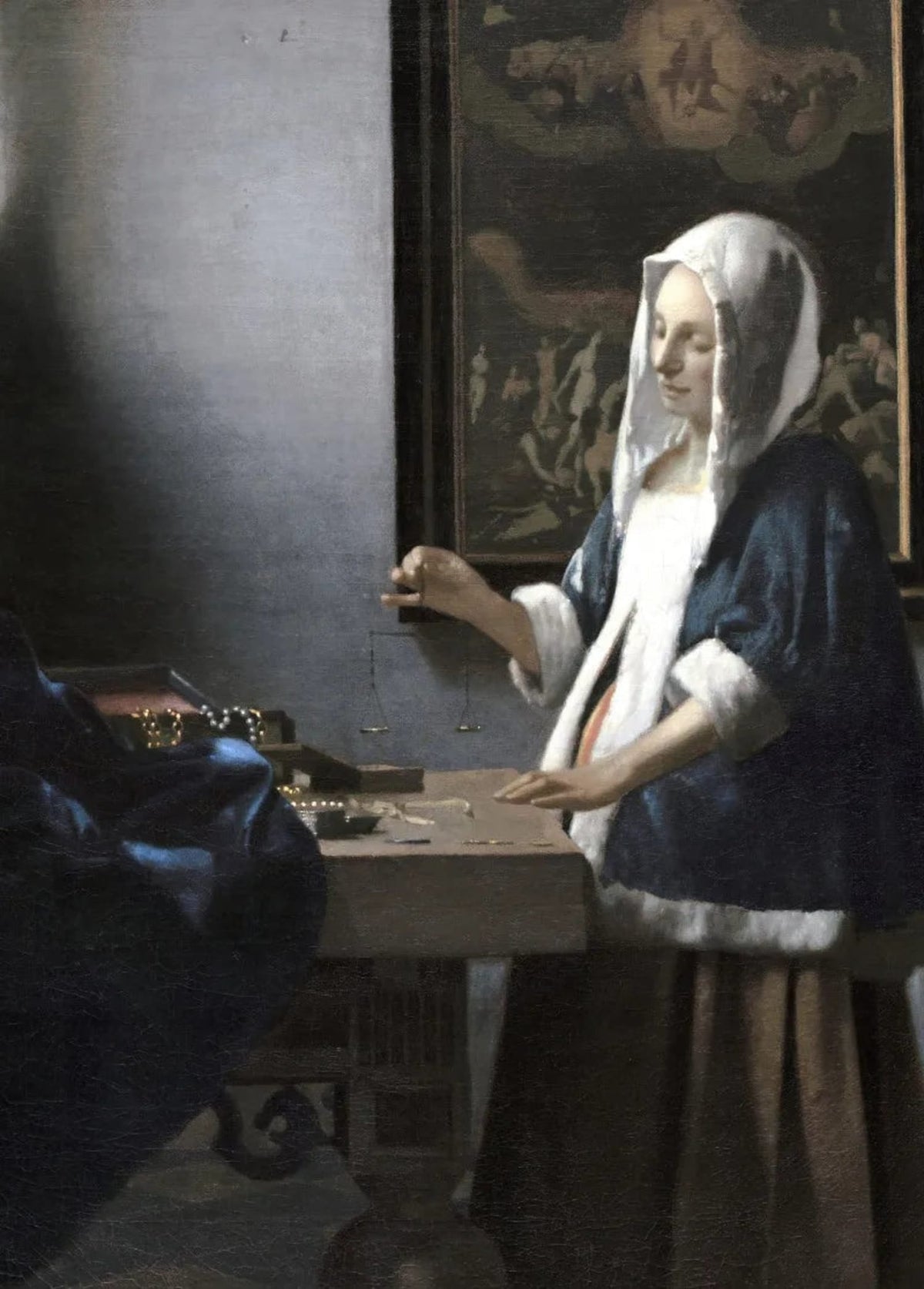 WOMAN HOLDING A BALANCE