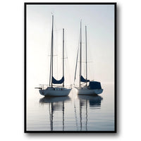 TWO SAILING BOATS AT SUNRISE